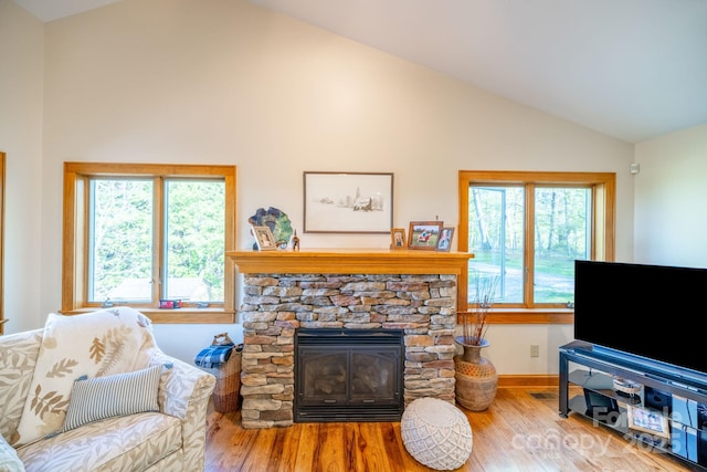 958 Alta Vista Ln, Sparta, NC 28675 - living room with baseboards, a fireplace, wood finished floors, and lofted ceiling