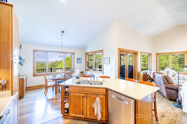 958 Alta Vista Ln, Sparta, NC 28675 - kitchen with stainless steel dishwasher, a sink, light wood-style flooring, and a wealth of natural light