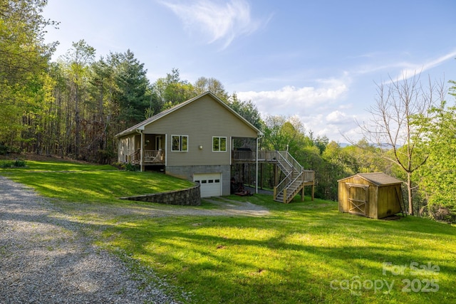 958 Alta Vista Ln, Sparta, NC 28675 - view of home's exterior with a storage unit, a lawn, driveway, and stairway