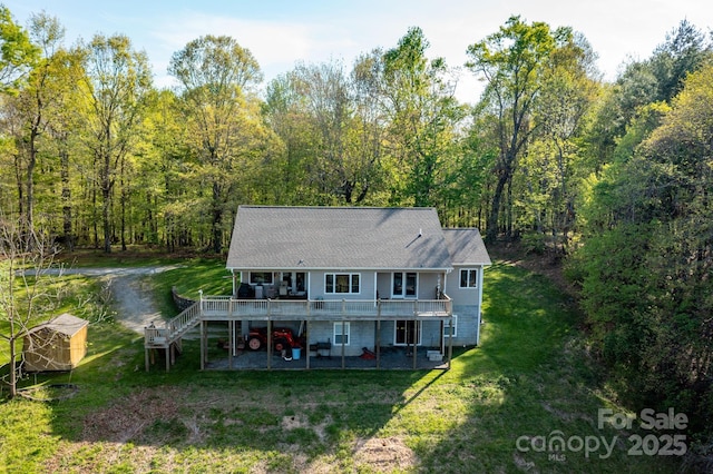 958 Alta Vista Ln, Sparta, NC 28675 - back of house featuring a view of trees, a wooden deck, a yard, and stairway