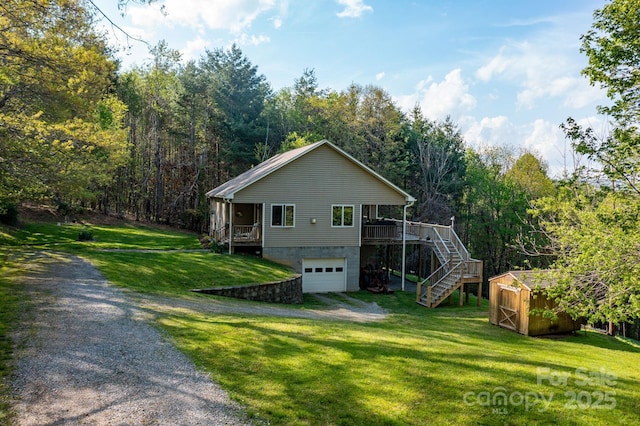 958 Alta Vista Ln, Sparta, NC 28675 - exterior space featuring driveway, a storage shed, a garage, a front lawn, and stairs