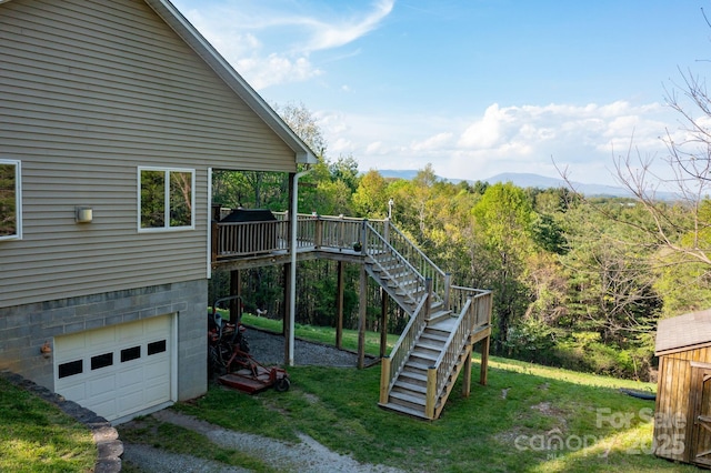 958 Alta Vista Ln, Sparta, NC 28675 - view of play area with a wooden deck, a yard, stairway, and a wooded view