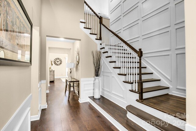 2854 Harlinsdale Dr, Rock Hill, SC 29732 - staircase with a towering ceiling, a decorative wall, and hardwood / wood-style flooring