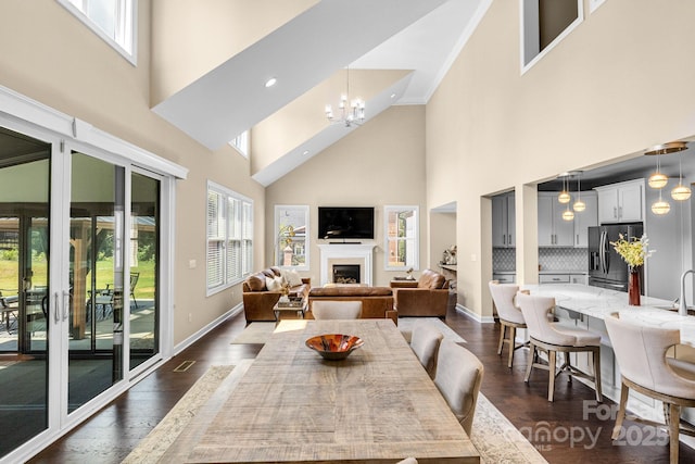 2854 Harlinsdale Dr, Rock Hill, SC 29732 - interior space featuring a high ceiling, a fireplace, a chandelier, and dark wood-type flooring