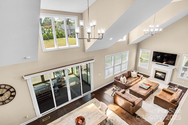 2854 Harlinsdale Dr, Rock Hill, SC 29732 - living area with a premium fireplace, a high ceiling, a chandelier, and wood finished floors