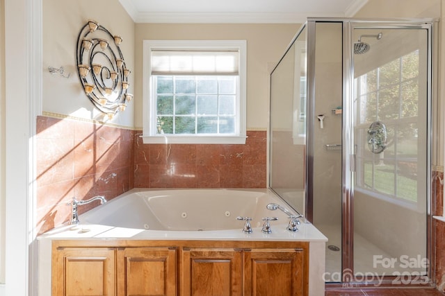 bathroom with ornamental molding, a whirlpool tub, and a stall shower