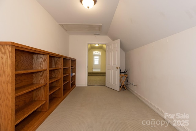bonus room featuring baseboards, lofted ceiling, and light carpet