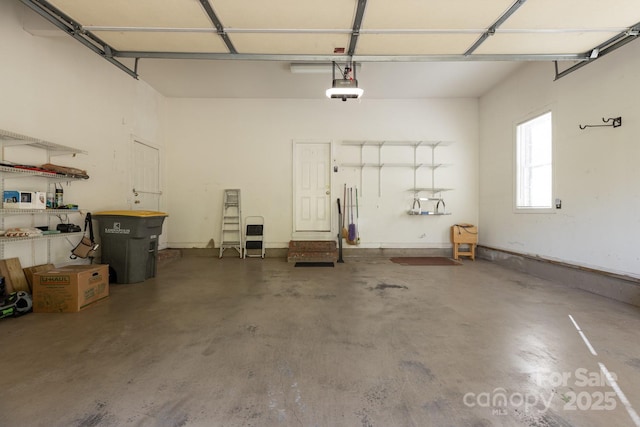 garage featuring a garage door opener