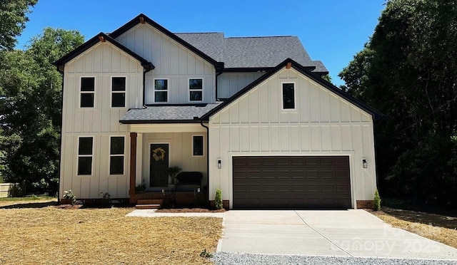 3114 Ansonville Rd, Marshville, NC 28103 - modern inspired farmhouse with roof with shingles, concrete driveway, board and batten siding, and a garage