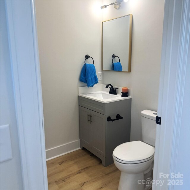3114 Ansonville Rd, Marshville, NC 28103 - half bath with vanity, wood finished floors, and toilet