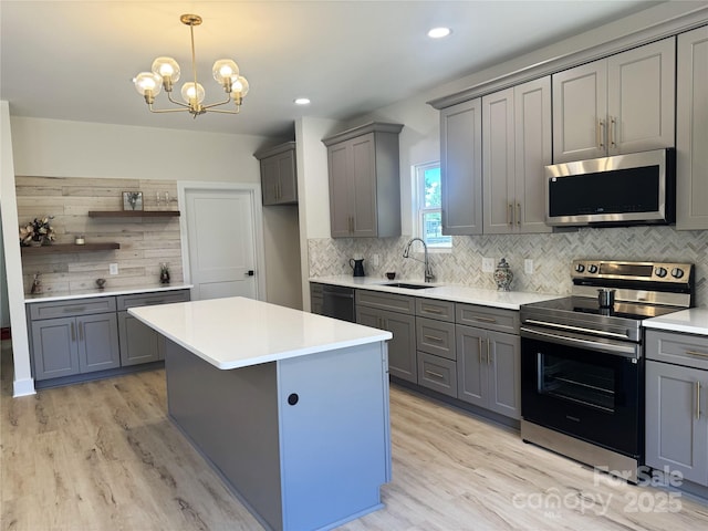 3114 Ansonville Rd, Marshville, NC 28103 - kitchen with stainless steel appliances, gray cabinetry, a sink, light wood-style floors, and recessed lighting