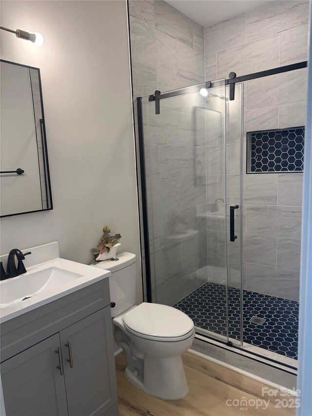3114 Ansonville Rd, Marshville, NC 28103 - full bath with toilet, vanity, wood finished floors, and a stall shower