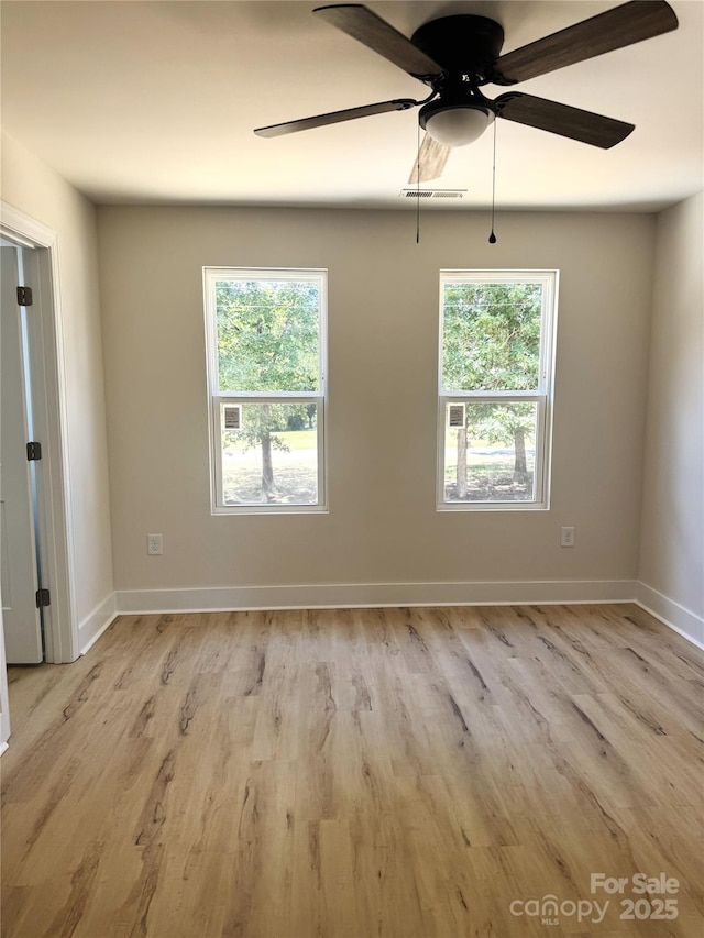 3114 Ansonville Rd, Marshville, NC 28103 - spare room featuring light wood finished floors, plenty of natural light, a ceiling fan, and baseboards