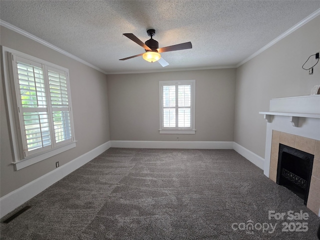 unfurnished living room featuring ceiling fan, ornamental molding, and carpet
