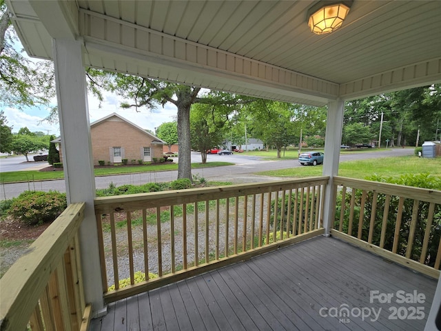 wooden terrace with a porch
