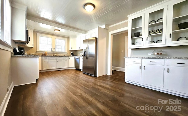 169 Freeze Ave NW, Concord, NC 28025 - kitchen featuring stainless steel appliances, crown molding, dark wood-type flooring, white cabinets, and glass insert cabinets