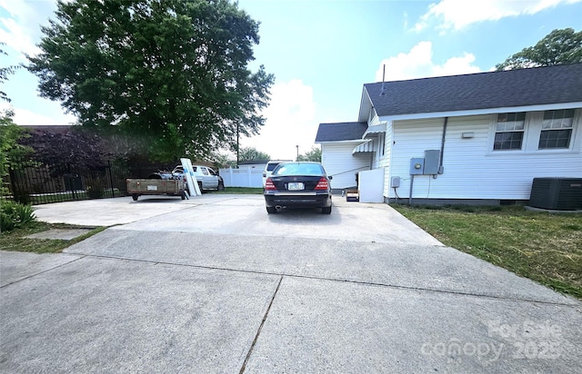 169 Freeze Ave NW, Concord, NC 28025 - view of property exterior with roof with shingles and driveway
