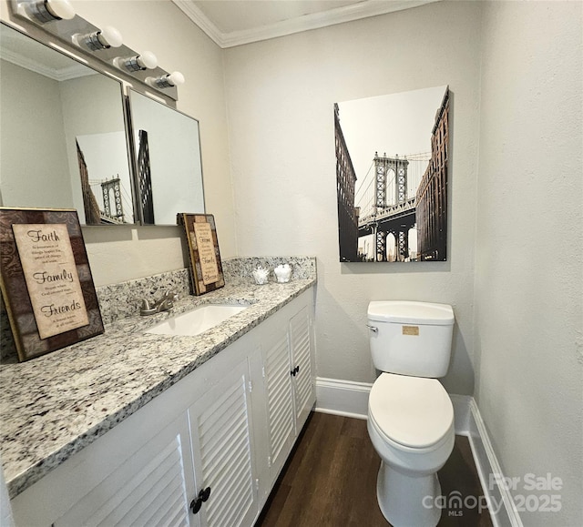 169 Freeze Ave NW, Concord, NC 28025 - bathroom with ornamental molding, wood finished floors, and vanity
