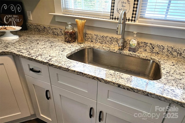 169 Freeze Ave NW, Concord, NC 28025 - kitchen view of light stone counters and white cabinets