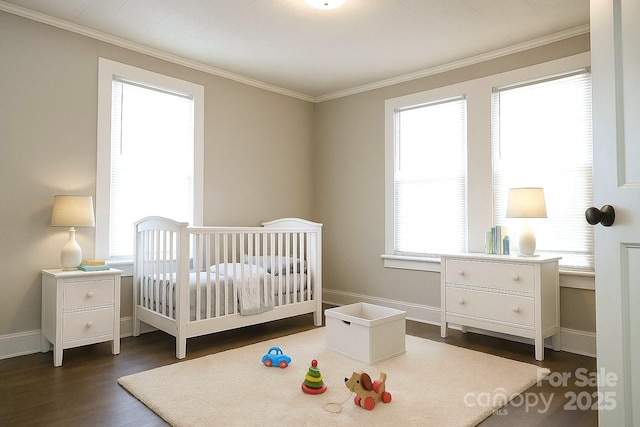 169 Freeze Ave NW, Concord, NC 28025 - bedroom featuring dark wood-style floors, crown molding, and a crib