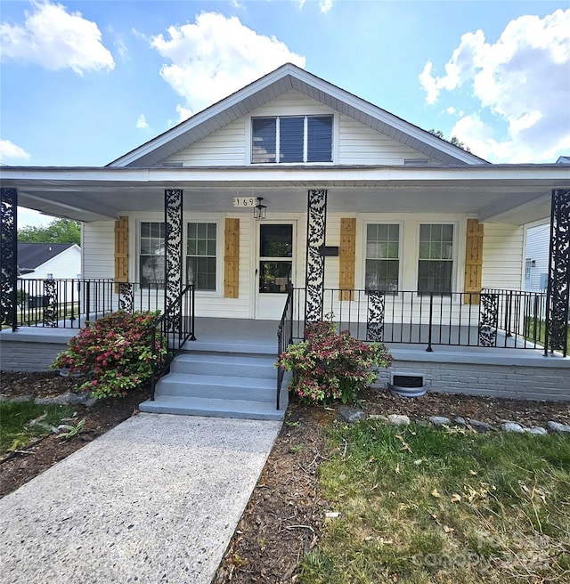 169 Freeze Ave NW, Concord, NC 28025 - view of front facade featuring a porch and crawl space