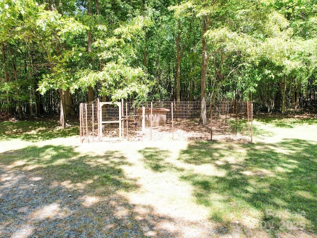 4901 Pine Oaks Dr, Monroe, NC 28112 - view of yard featuring fence and a view of trees