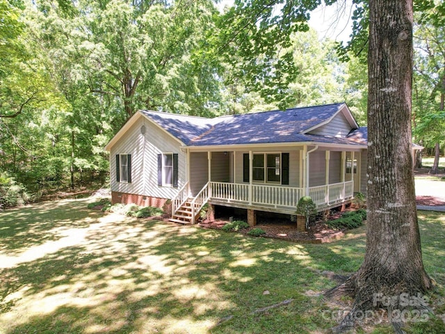 4901 Pine Oaks Dr, Monroe, NC 28112 - ranch-style house with a shingled roof, crawl space, covered porch, and a front yard