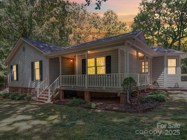 4901 Pine Oaks Dr, Monroe, NC 28112 - view of front of home with covered porch, crawl space, and a front yard