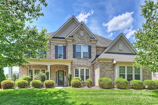 9825 Ardrey Woods Dr, Charlotte, NC 28277 - craftsman-style house featuring brick siding and a front yard