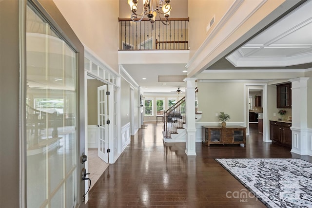 9825 Ardrey Woods Dr, Charlotte, NC 28277 - foyer entrance featuring crown molding, a notable chandelier, decorative columns, and french doors
