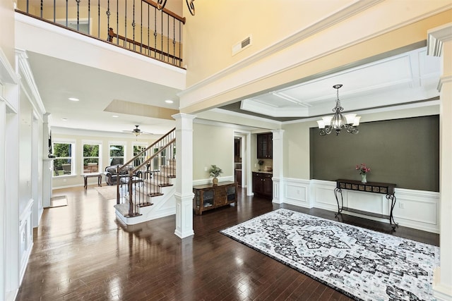 9825 Ardrey Woods Dr, Charlotte, NC 28277 - entrance foyer with ornate columns, visible vents, wood finished floors, and stairway