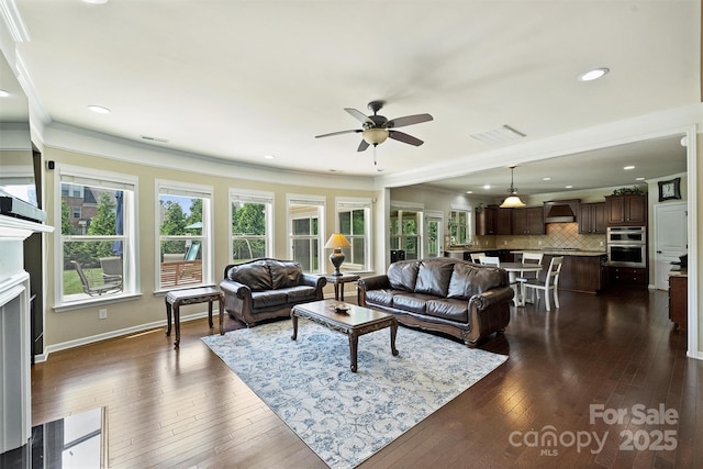 9825 Ardrey Woods Dr, Charlotte, NC 28277 - living area featuring crown molding, a ceiling fan, dark wood finished floors, and visible vents