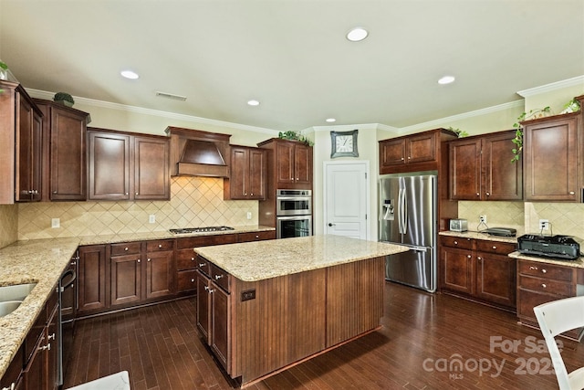 9825 Ardrey Woods Dr, Charlotte, NC 28277 - kitchen with visible vents, a center island, custom range hood, backsplash, and stainless steel appliances