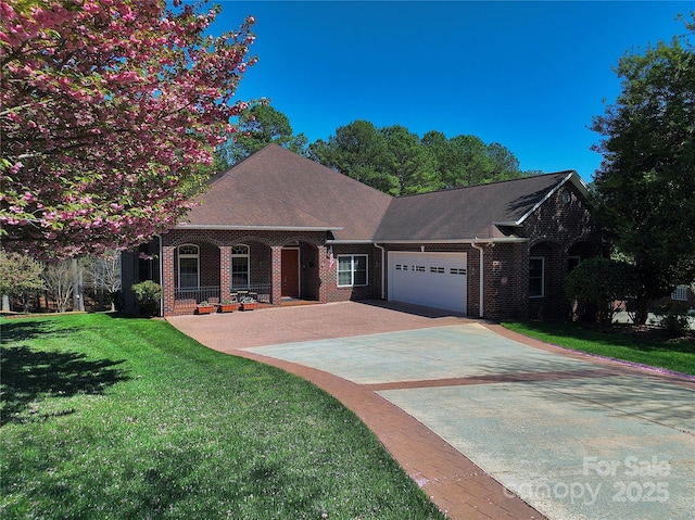 5342 Beacon Ridge Dr, Granite Falls, NC 28630 - view of front of property featuring an attached garage, brick siding, a front yard, and concrete driveway