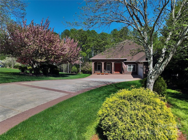 5342 Beacon Ridge Dr, Granite Falls, NC 28630 - view of front of property with a front lawn, brick siding, a porch, and driveway