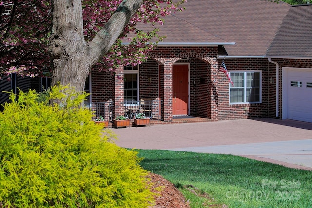 5342 Beacon Ridge Dr, Granite Falls, NC 28630 - view of front of property featuring brick siding, a shingled roof, a garage, and driveway