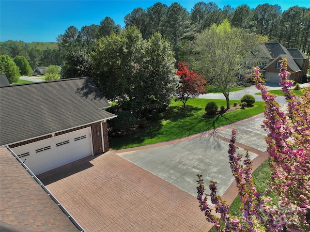 5342 Beacon Ridge Dr, Granite Falls, NC 28630 - view of community with a lawn, decorative driveway, and a garage