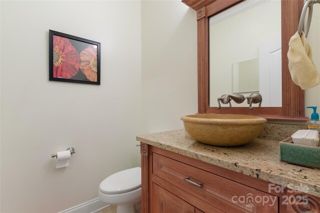 5342 Beacon Ridge Dr, Granite Falls, NC 28630 - bathroom featuring vanity, toilet, and baseboards