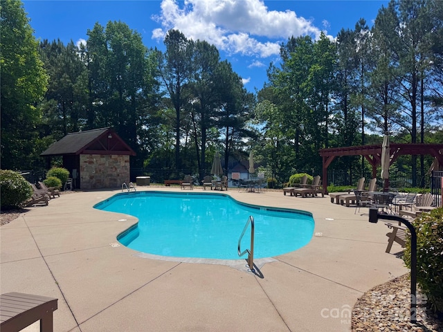5342 Beacon Ridge Dr, Granite Falls, NC 28630 - community pool featuring a pergola, a patio, fence, and view of scattered trees