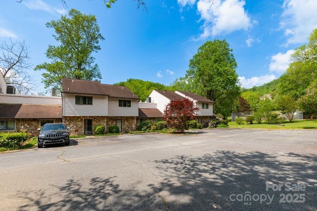 87 Marion Forest Rd Unit 8, Sylva, NC 28779 - view of front of house with uncovered parking and stone siding