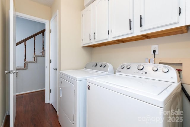 87 Marion Forest Rd Unit 8, Sylva, NC 28779 - washroom featuring washing machine and dryer, dark wood-style floors, and cabinet space