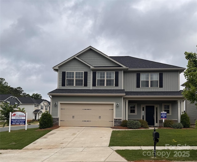 704 Robert Moses Dr Unit 121, Gastonia, NC 28056 - craftsman-style house with a garage, a front lawn, driveway, and stone siding
