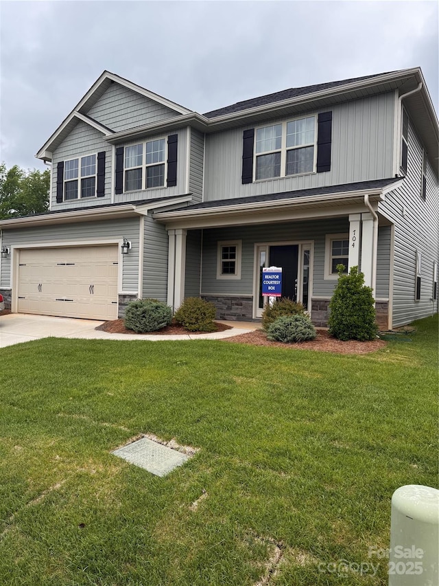 704 Robert Moses Dr Unit 121, Gastonia, NC 28056 - view of front of property with board and batten siding, a garage, a front lawn, concrete driveway, and stone siding