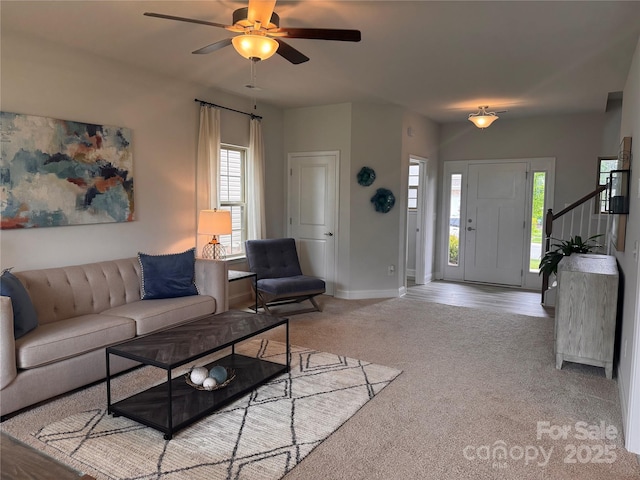 704 Robert Moses Dr Unit 121, Gastonia, NC 28056 - carpeted living area with plenty of natural light, a ceiling fan, baseboards, and stairs