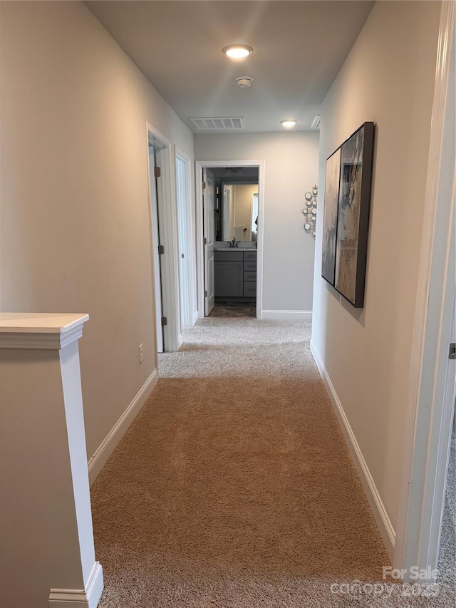 704 Robert Moses Dr Unit 121, Gastonia, NC 28056 - hallway with baseboards, carpet flooring, and visible vents
