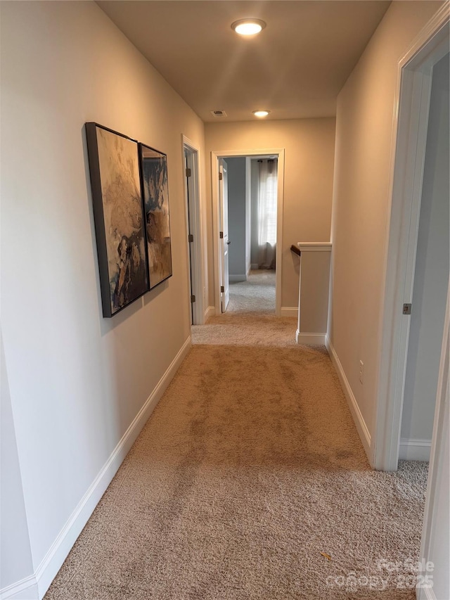 704 Robert Moses Dr Unit 121, Gastonia, NC 28056 - hall with baseboards, an upstairs landing, and carpet
