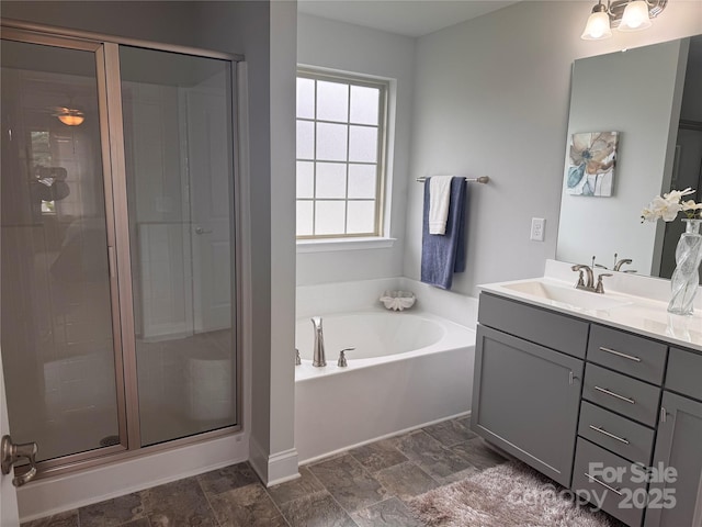 704 Robert Moses Dr Unit 121, Gastonia, NC 28056 - full bathroom with vanity, stone finish floor, a garden tub, and a stall shower