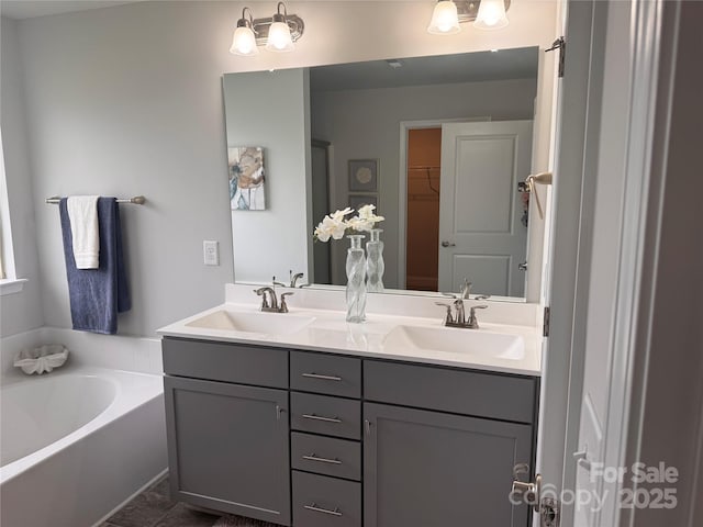 704 Robert Moses Dr Unit 121, Gastonia, NC 28056 - bathroom with double vanity, a sink, a walk in closet, and a bath