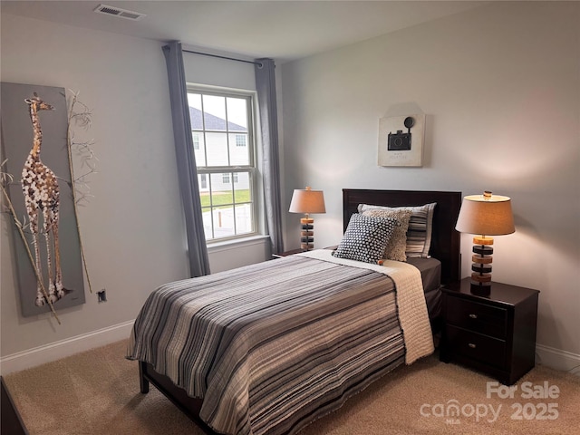 704 Robert Moses Dr Unit 121, Gastonia, NC 28056 - bedroom with baseboards, light carpet, and visible vents