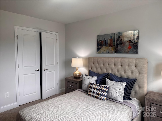 704 Robert Moses Dr Unit 121, Gastonia, NC 28056 - carpeted bedroom featuring baseboards and a closet